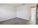 Bedroom with wood-look floors and access to balcony at 3825 Pompano Se Dr, St Petersburg, FL 33705