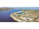 Wide aerial view of waterfront community, lake, and city skyline at 3825 Pompano Se Dr, St Petersburg, FL 33705