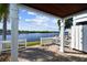 A patio with a white railing overlooks a calm waterway at 3825 Pompano Se Dr, St Petersburg, FL 33705