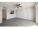 Living room with grey walls and vinyl plank flooring at 3825 Pompano Se Dr, St Petersburg, FL 33705