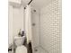 Small bathroom with shower and subway tile at 1003 W River Heights Ave, Tampa, FL 33603