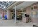 Covered patio with outdoor kitchen and seating area at 246 Old Oak Cir, Palm Harbor, FL 34683