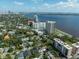 Aerial view of waterfront property with city skyline in background at 2413 Bayshore Blvd # 1401, Tampa, FL 33629