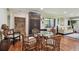 Bright dining area with glass-top table and wicker chairs at 36750 Us Highway 19 N # 05213, Palm Harbor, FL 34684