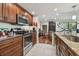 Modern kitchen with stainless steel appliances and granite countertops at 36750 Us Highway 19 N # 05213, Palm Harbor, FL 34684