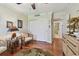 Bright home office with hardwood floors, ceiling fan, and built-in cabinetry at 36750 Us Highway 19 N # 05213, Palm Harbor, FL 34684