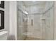 Large walk-in shower with glass enclosure and tile surround at 36750 Us Highway 19 N # 05213, Palm Harbor, FL 34684