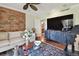 Living room with large TV, comfortable seating and stylish decor at 36750 Us Highway 19 N # 05213, Palm Harbor, FL 34684