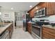Modern kitchen with stainless steel appliances and granite countertops at 36750 Us Highway 19 N # 05213, Palm Harbor, FL 34684