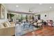 Spacious living room with hardwood floors and access to balcony at 36750 Us Highway 19 N # 05213, Palm Harbor, FL 34684