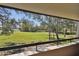 Expansive balcony view overlooking a tranquil golf course at 36750 Us Highway 19 N # 05213, Palm Harbor, FL 34684