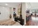 Entryway with hardwood floors, view of kitchen and front door at 36750 Us Highway 19 N # 05213, Palm Harbor, FL 34684