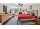 Bright bedroom with hardwood floors, ceiling fan and large bed at 36750 Us Highway 19 N # 05213, Palm Harbor, FL 34684
