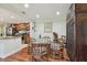 Open concept dining area with kitchen views and wood floors at 36750 Us Highway 19 N # 05213, Palm Harbor, FL 34684