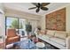 Bright living room with a view of the golf course from the balcony at 36750 Us Highway 19 N # 05213, Palm Harbor, FL 34684