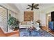 Relaxing living room featuring a comfortable sofa and large windows at 36750 Us Highway 19 N # 05213, Palm Harbor, FL 34684