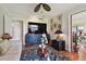 Living room showcasing a large flat-screen TV and comfortable seating at 36750 Us Highway 19 N # 05213, Palm Harbor, FL 34684