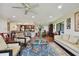 Open living room with hardwood floors and kitchen view at 36750 Us Highway 19 N # 05213, Palm Harbor, FL 34684