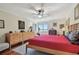 Large bedroom with hardwood floors, ceiling fan and dresser at 36750 Us Highway 19 N # 05213, Palm Harbor, FL 34684