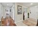 Long hallway with hardwood floors and access to other rooms at 36750 Us Highway 19 N # 05213, Palm Harbor, FL 34684