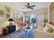Living area with comfortable seating, large windows and access to balcony at 36750 Us Highway 19 N # 05213, Palm Harbor, FL 34684