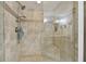 Walk-in shower with tile surround and built-in seat at 36750 Us Highway 19 N # 05213, Palm Harbor, FL 34684