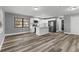 Open concept kitchen featuring white cabinets and a kitchen island at 6185 Alderwood St, Spring Hill, FL 34606