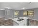 Modern kitchen island with sink and stainless steel appliances at 6185 Alderwood St, Spring Hill, FL 34606