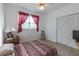 Cozy bedroom with double closet and patterned bedding at 9815 Golden Loop, New Port Richey, FL 34654