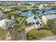 Beautiful waterfront home featuring a green metal roof, solar panels, and dock access to canal at 1104 Kingfish Pl, Apollo Beach, FL 33572