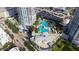 Aerial view of a community with a luxurious swimming pool and manicured landscaping at 1209 E Cumberland Ave # 508, Tampa, FL 33602