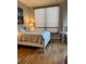 Cozy bedroom featuring a comfortable bed, large window, and modern decor at 1209 E Cumberland Ave # 508, Tampa, FL 33602
