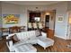 Open-concept living area with hardwood floors, comfortable seating, and easy access to the kitchen and dining space at 1209 E Cumberland Ave # 508, Tampa, FL 33602