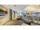Modern lounge area features a large screen television and comfortable leather furniture with a calming color scheme at 1209 E Cumberland Ave # 508, Tampa, FL 33602