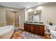 Spacious bathroom with double vanity, soaking tub, and glass-enclosed shower at 1209 E Cumberland Ave # 508, Tampa, FL 33602