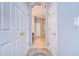 Hallway view to primary bathroom, with walk-in shower and dual sink vanity at 15501 Pepper Pine Ct, Land O Lakes, FL 34638