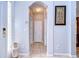 Bright, open foyer with tile flooring, archways, and a view into the house at 15501 Pepper Pine Ct, Land O Lakes, FL 34638