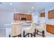 Kitchen with breakfast bar featuring seating and modern finishes at 15501 Pepper Pine Ct, Land O Lakes, FL 34638