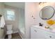 Updated bathroom with marble shower, white vanity, and modern fixtures at 2230 Melrose S Ave, St Petersburg, FL 33712