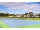 Community tennis courts with green surface and net at 15501 Pepper Pine Ct, Land O Lakes, FL 34638