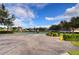 Tennis courts with parking and surrounding landscape at 15501 Pepper Pine Ct, Land O Lakes, FL 34638