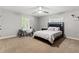 Well-lit bedroom with a built-in desk and window at 27929 Lincoln Pl, Wesley Chapel, FL 33544