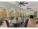 Covered patio with arched columns, terracotta tile, and outdoor dining furniture at 2520 W Shell Point Rd, Tampa, FL 33611