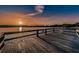 Tranquil sunset view from a wooden dock on a calm lake at 2293 Swedish Dr # 43, Clearwater, FL 33763