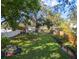 Spacious backyard with mature trees and a creek at 2820 W Leila Ave, Tampa, FL 33611