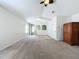 Spacious main bedroom with high ceilings and neutral color palette at 4630 Pointe O Woods Dr, Wesley Chapel, FL 33543