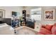 A bright office with built-in shelving, desk and a window at 1804 Pacific Dunes Dr, Sun City Center, FL 33573