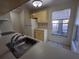 Kitchen with light-colored cabinets and stainless steel sink at 2672 Arjay Ct, Palm Harbor, FL 34684