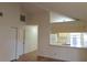 Bright living room with hardwood floors and view of kitchen at 2672 Arjay Ct, Palm Harbor, FL 34684
