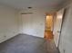 Spacious bedroom with neutral carpeting and ample closet space at 2672 Arjay Ct, Palm Harbor, FL 34684